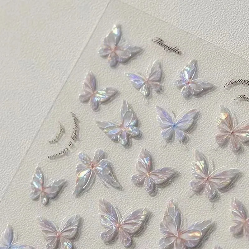 Iridescent butterfly-shaped stickers on a textured surface